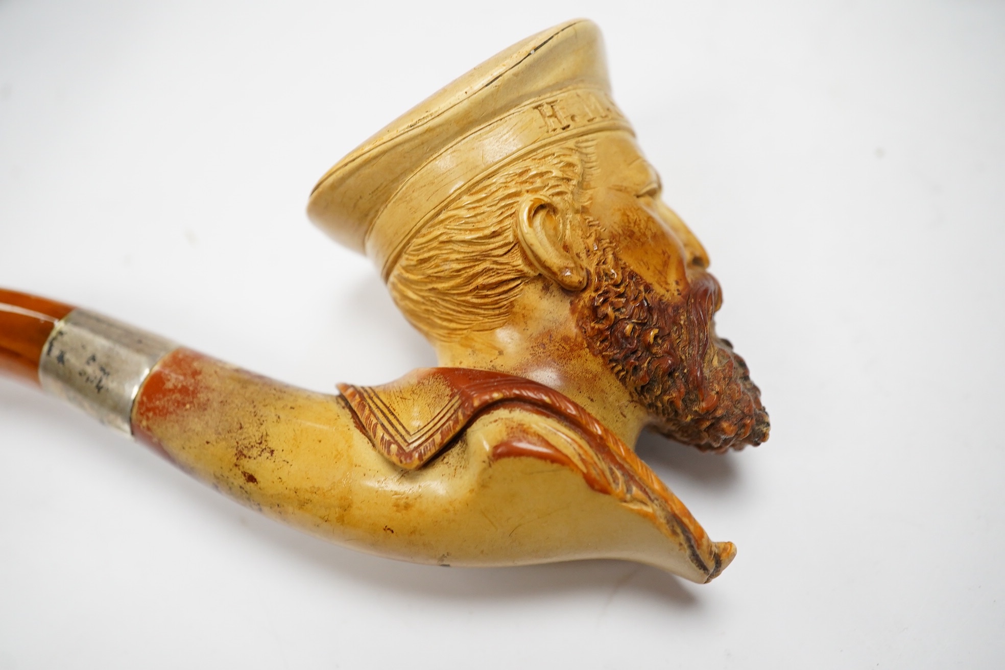 Three cased assorted Meerschaum pipes; sailor, boy on a pole and a Turk, largest Turk 19cm long. Condition - all pipes have damage either in pipe bowls or amber, cases worn